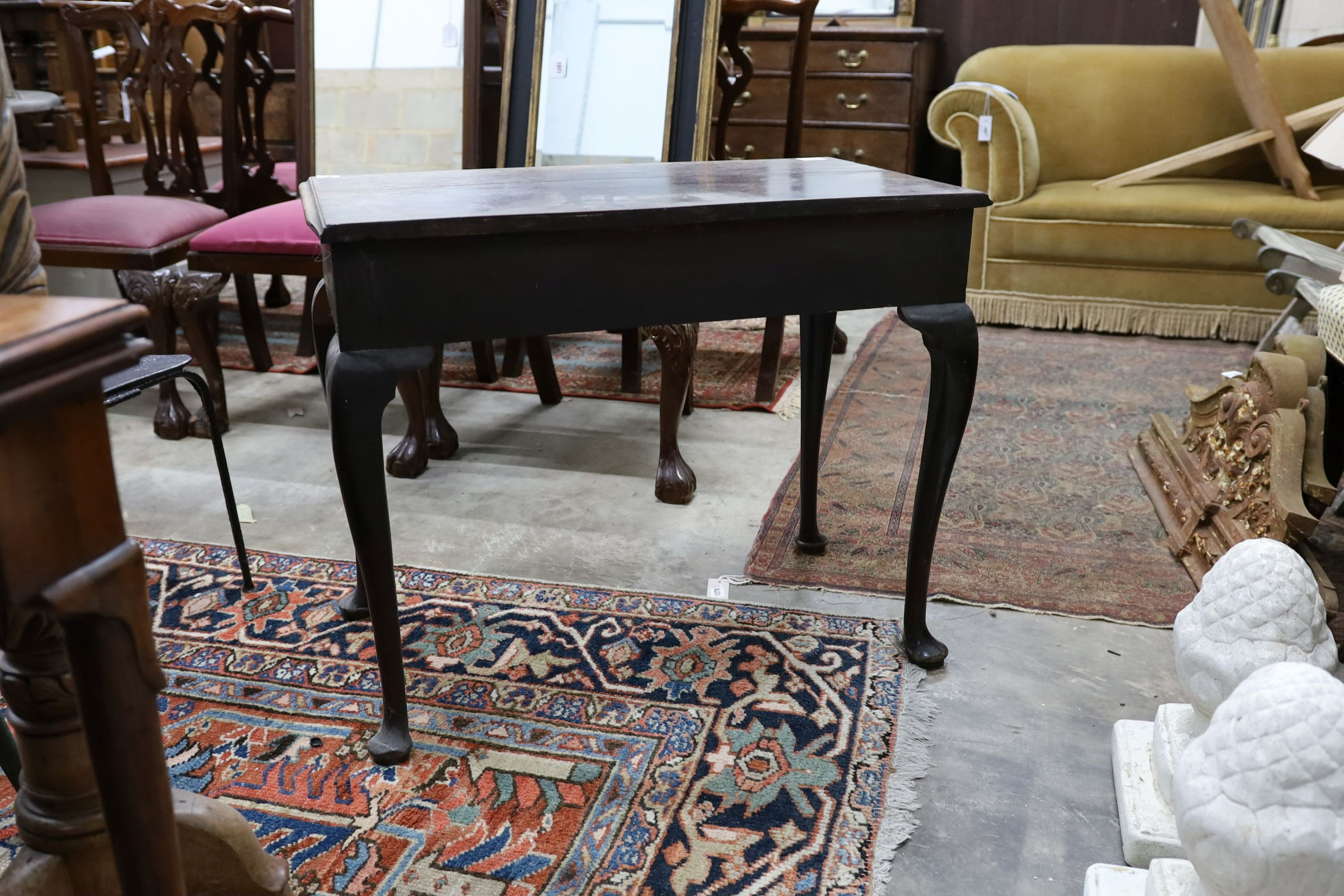 A George III mahogany side table, fitted with a single drawer, on cabriole legs, width 83cm, depth 48cm, height 67cm